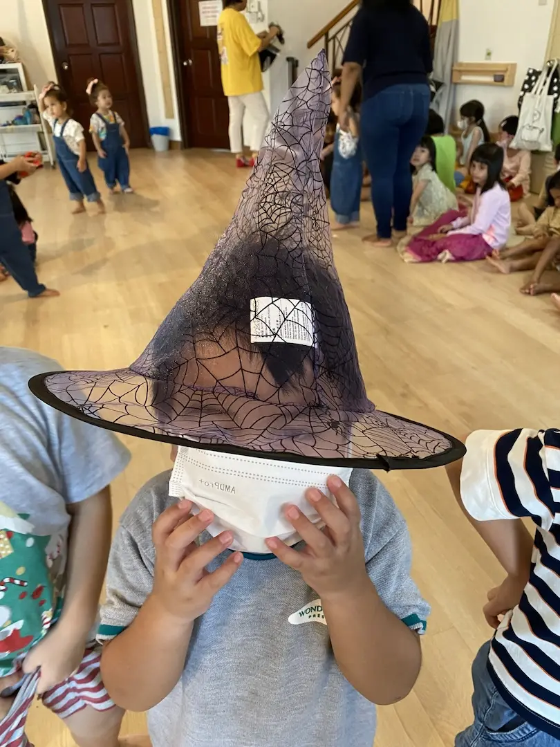 A child in a witch hat on a dress-up day