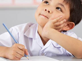 boy thinking in classroom