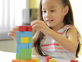 girl playing with blocks