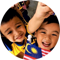 malaysian kids dancing with flag