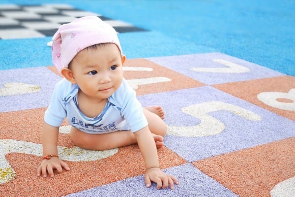 asian toddler on playground